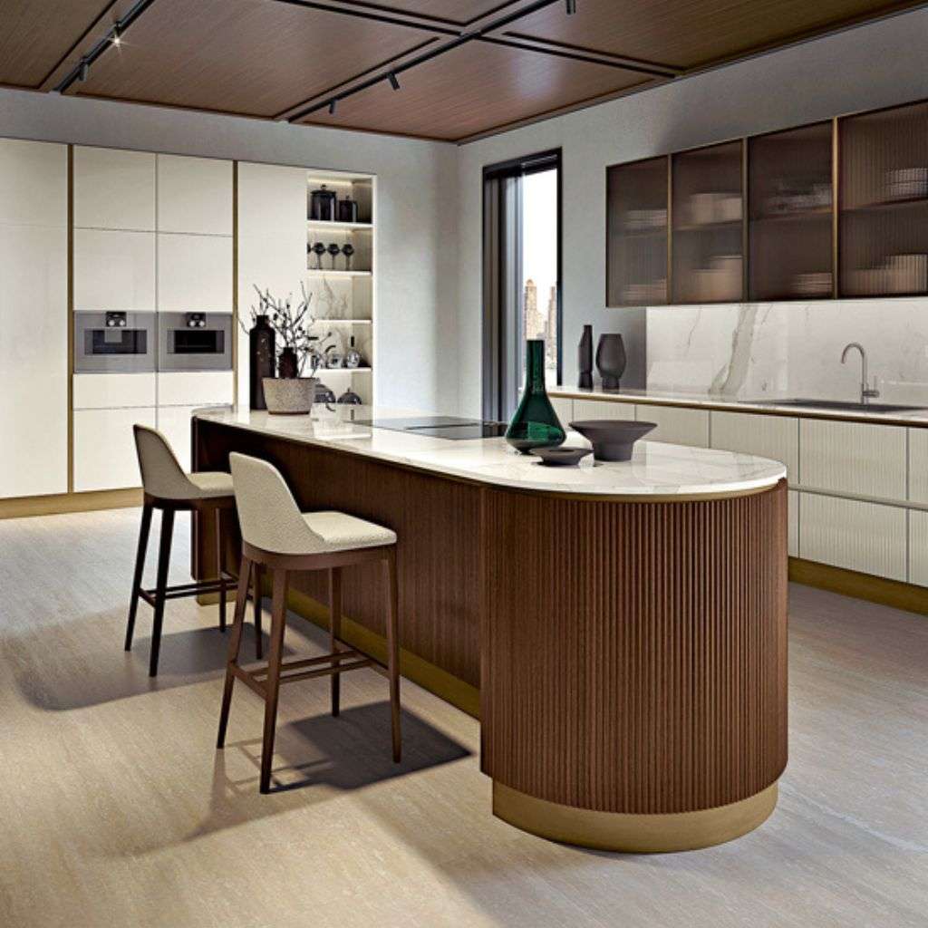 Bamax kitchen with a modern island and white countertops.
