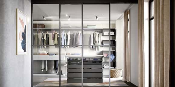 Walk-In Wardrobe with 3 transparent doors by FCI London