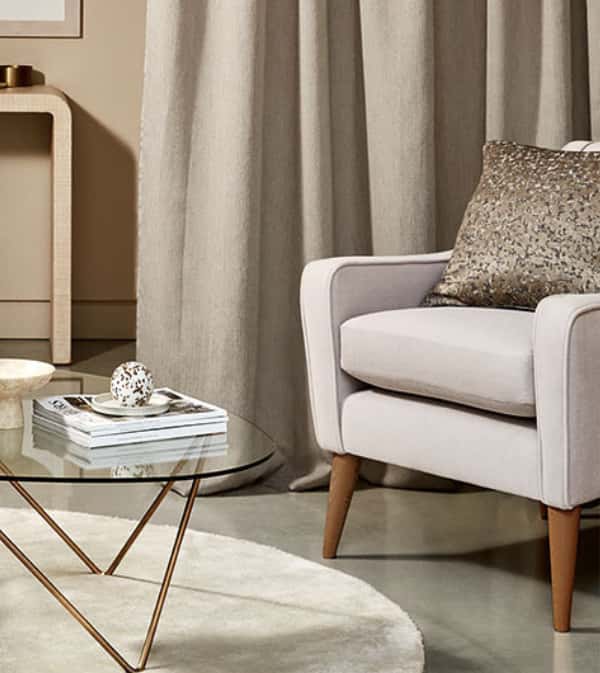 Comfortable reading nook with Villanova armchair and small table.