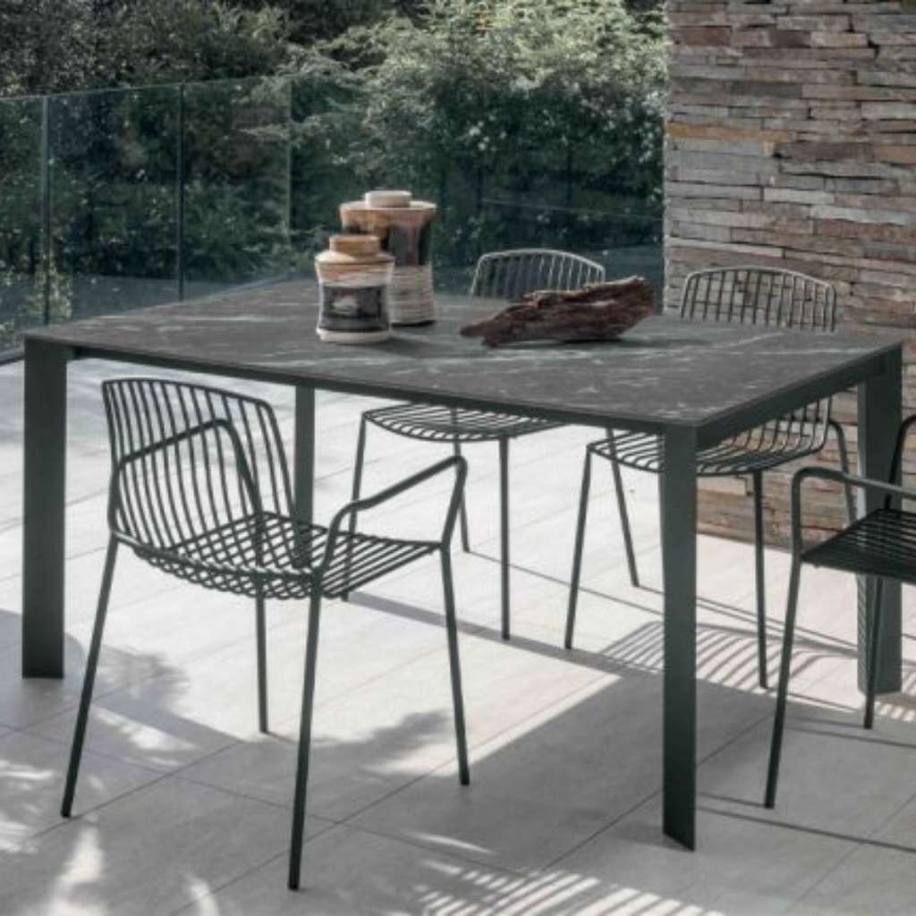 Altacom modern dining table with metal frame and outdoor seating arrangement.