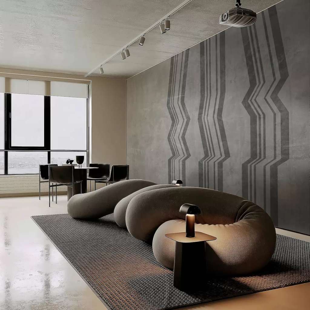 Tecnografica’s modern living space with abstract wall designs and minimalist furnishings.