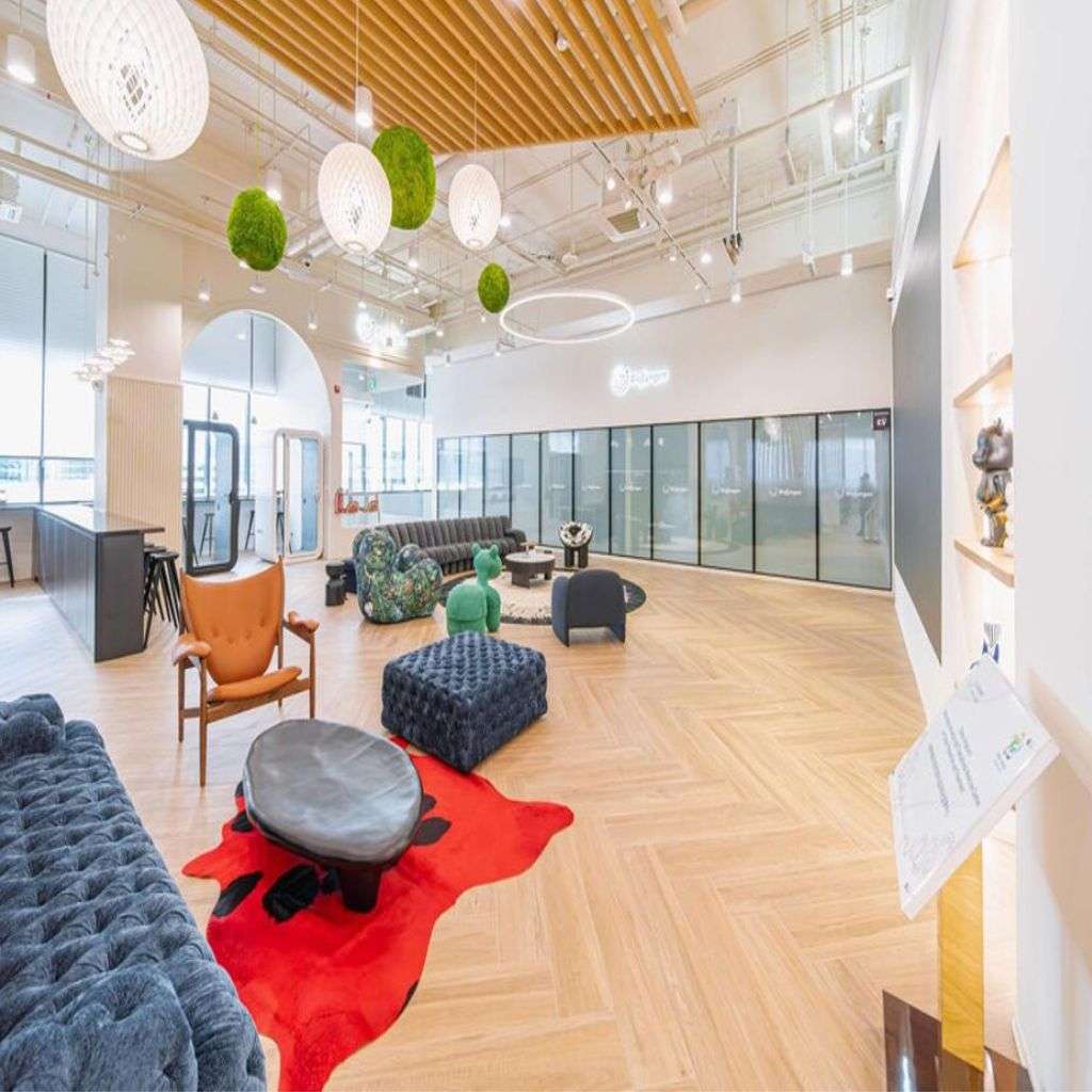 Stylish white narrow sideboard with artwork, complementing a spacious, contemporary living area.