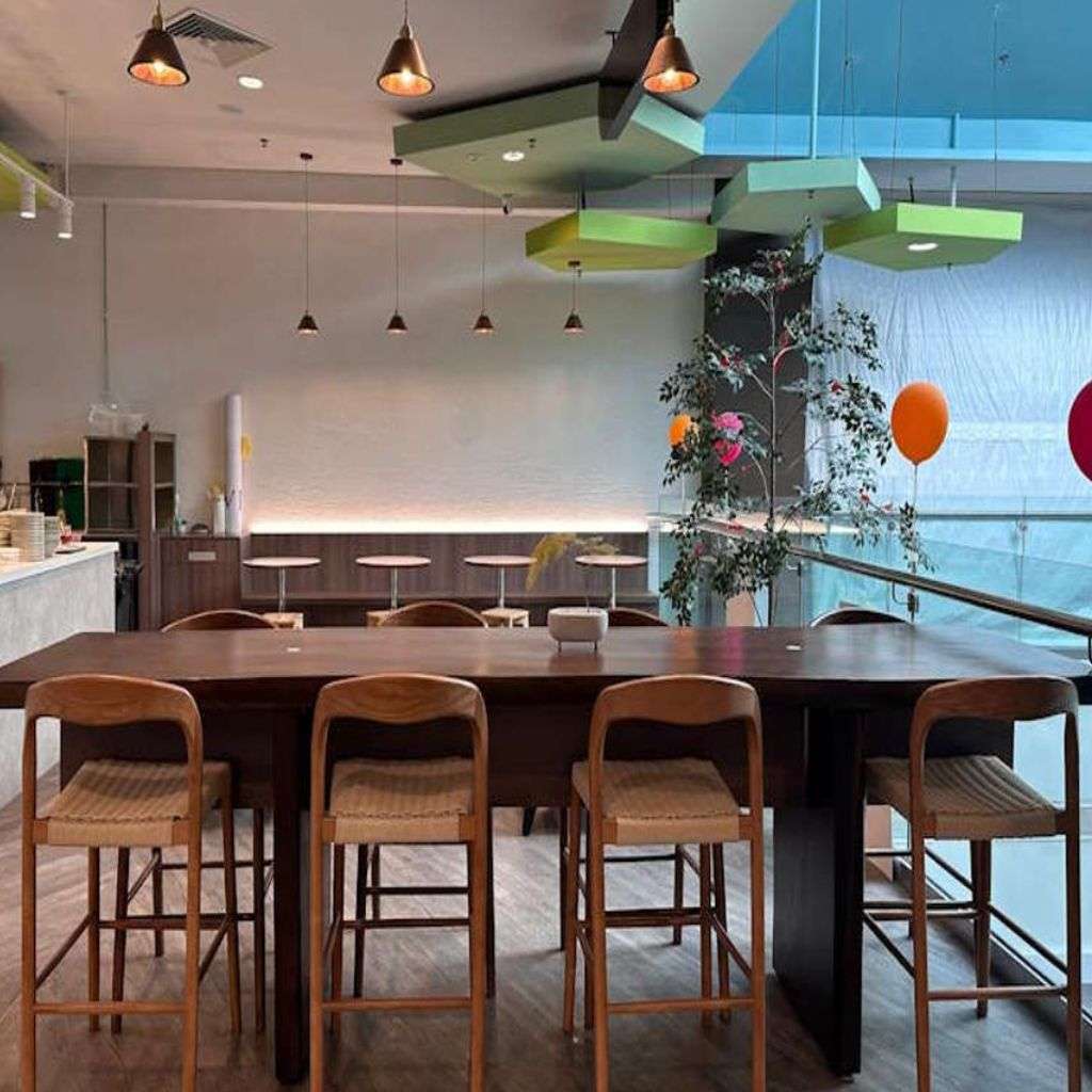 Modern seating and vibrant decor in a stylish space designed by Albedo Design.