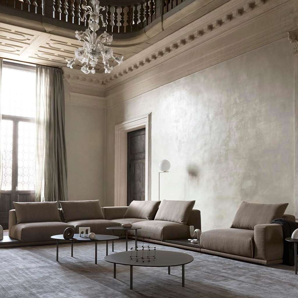 Alf DaFre modular taupe sectional with round coffee tables in a grand neutral living room.