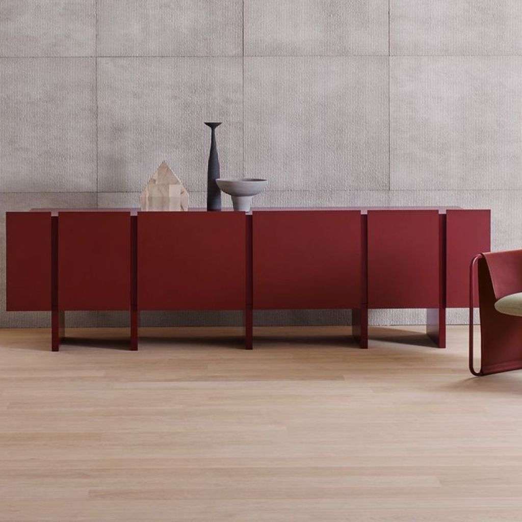 Amura red sideboard and contemporary armchair in an elegant space. 