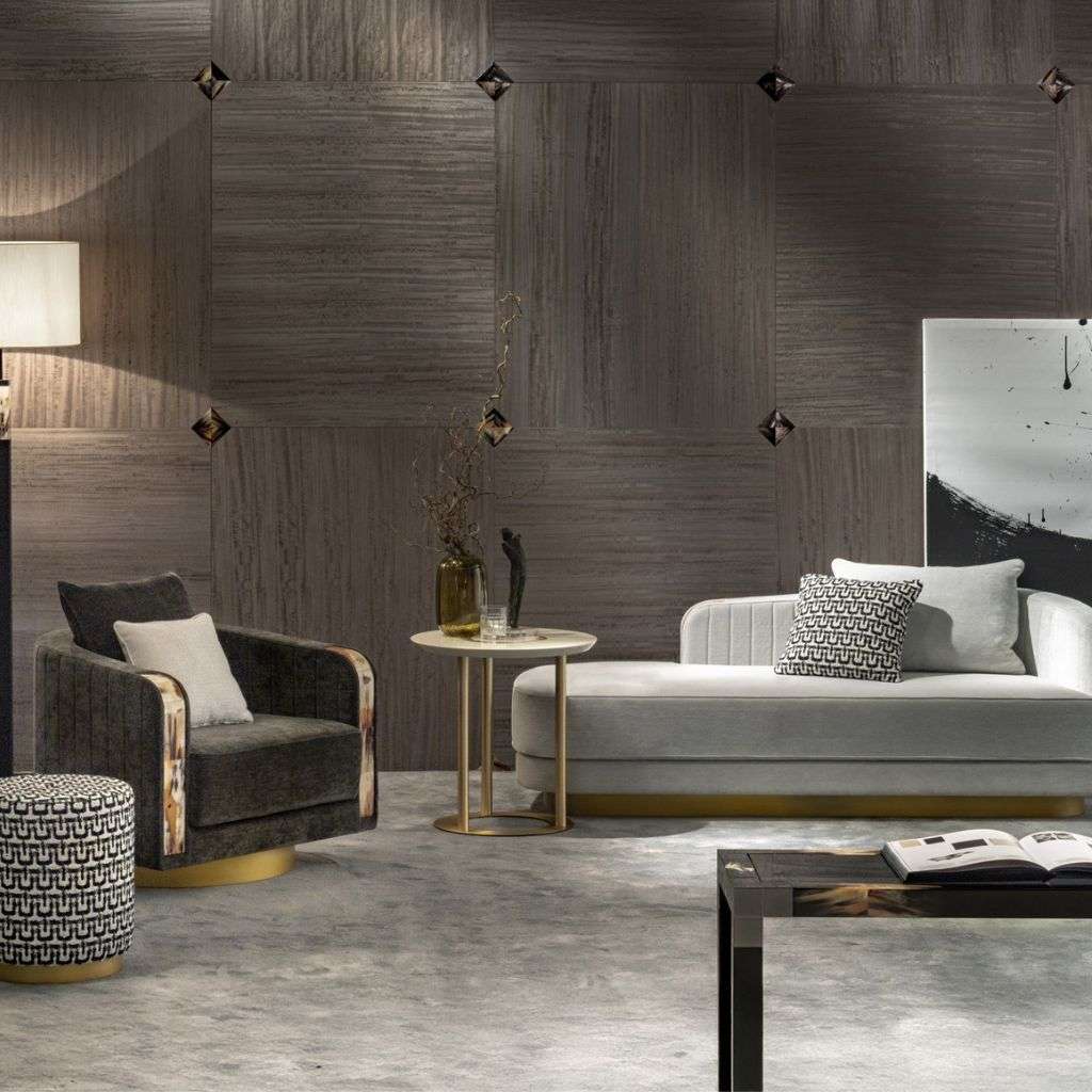 arcahorn chaise lounge with accent chair and gold base side table.