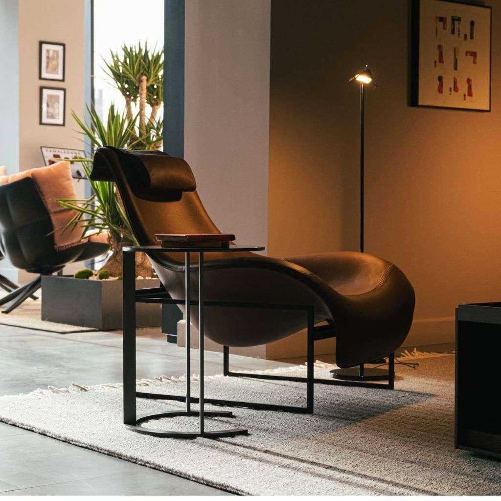 B&B Letti black leather lounge chair with ambient lighting and minimal decor.