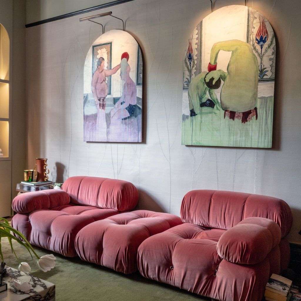 B&B Letti pink modular sofa complemented by unique art pieces in a chic setting.