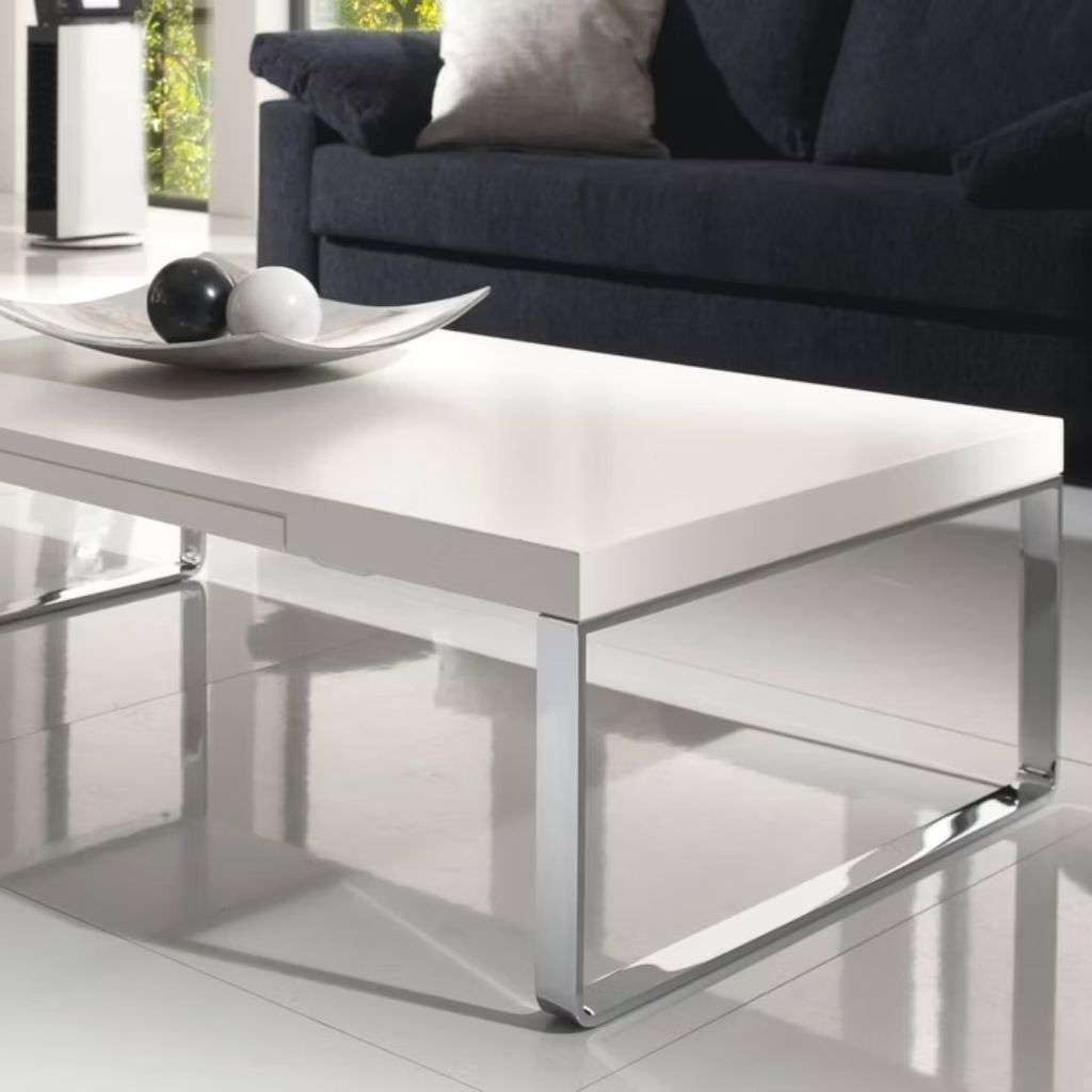 Bacher Tische white coffee table with chrome legs in a luxury living room.