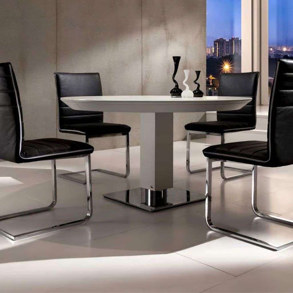 Bacher Tische round dining table with black chairs in a modern dining room.