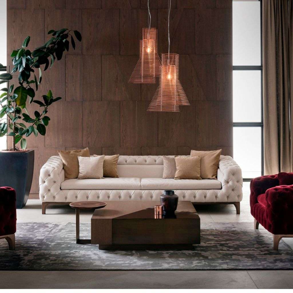 Bamax living room featuring tufted furniture and contemporary lighting.