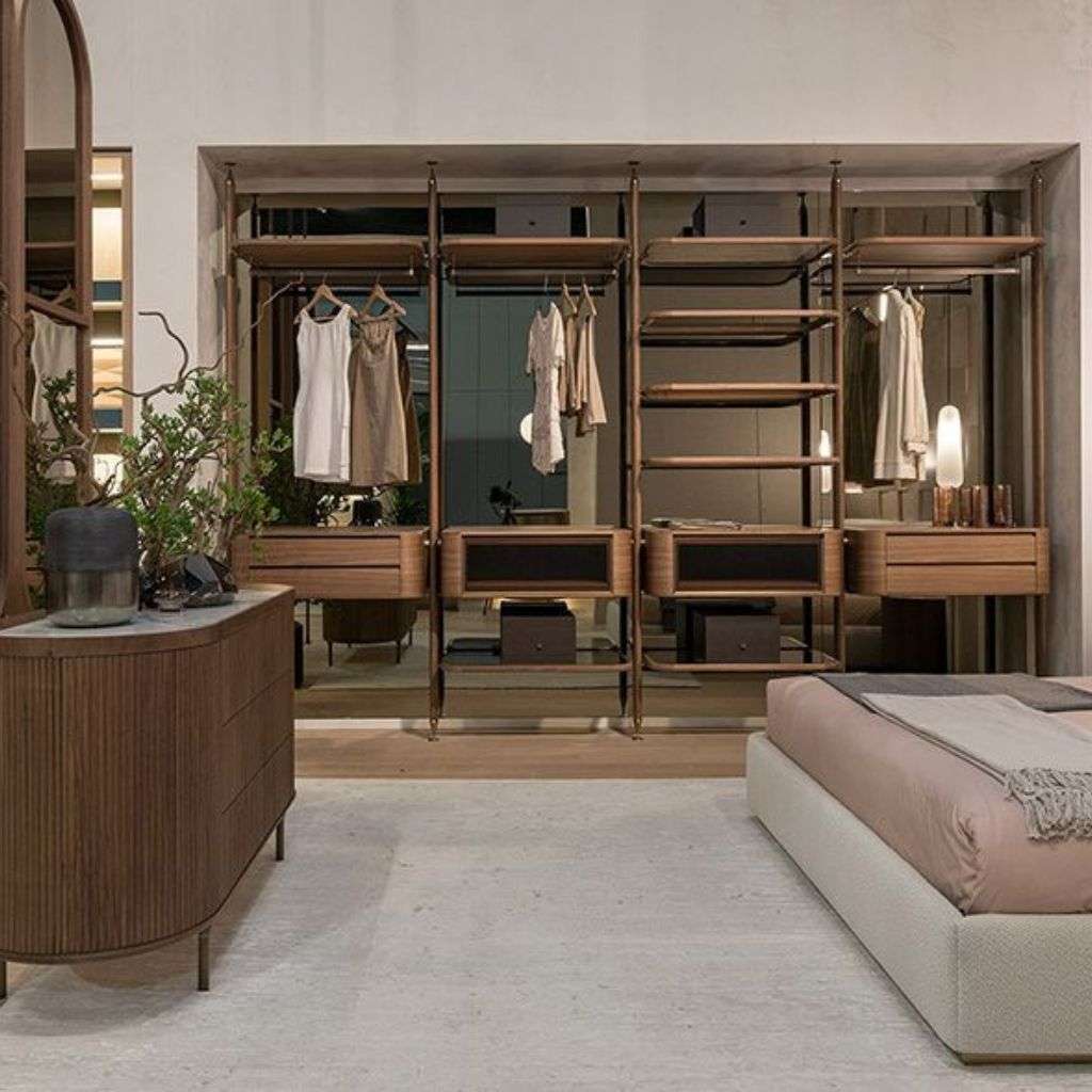 Bamax wardrobe system in a modern bedroom with wooden shelves.