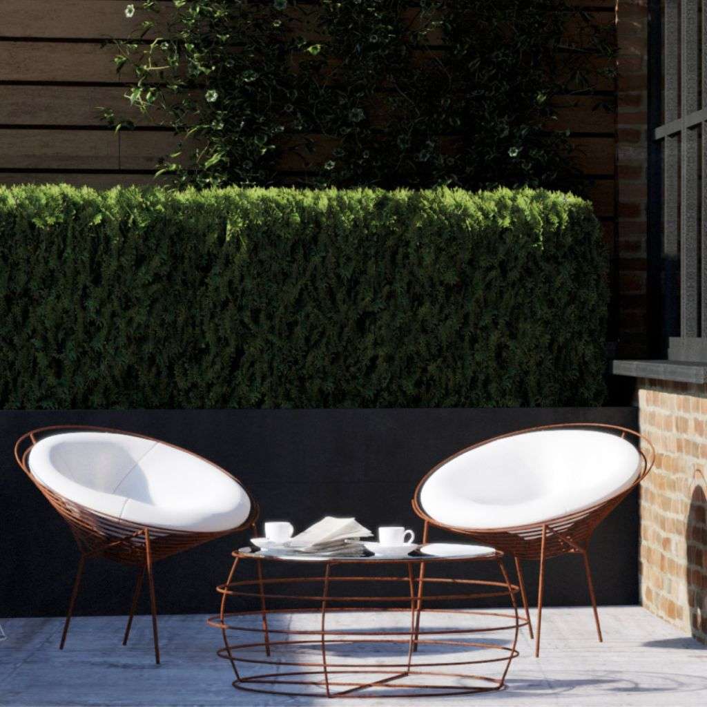 Barel’s modern outdoor seating arrangement with clean lines and fresh greenery.