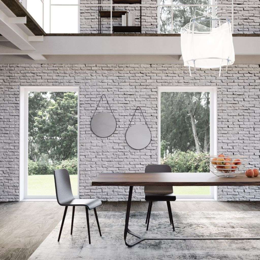 Minimalist dining area with sleek design and natural light from Barel.