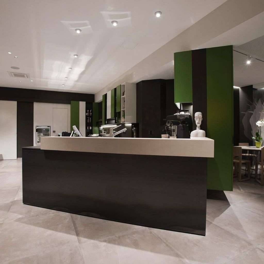 Barel’s sleek coffee bar area with a sophisticated green and black color scheme.