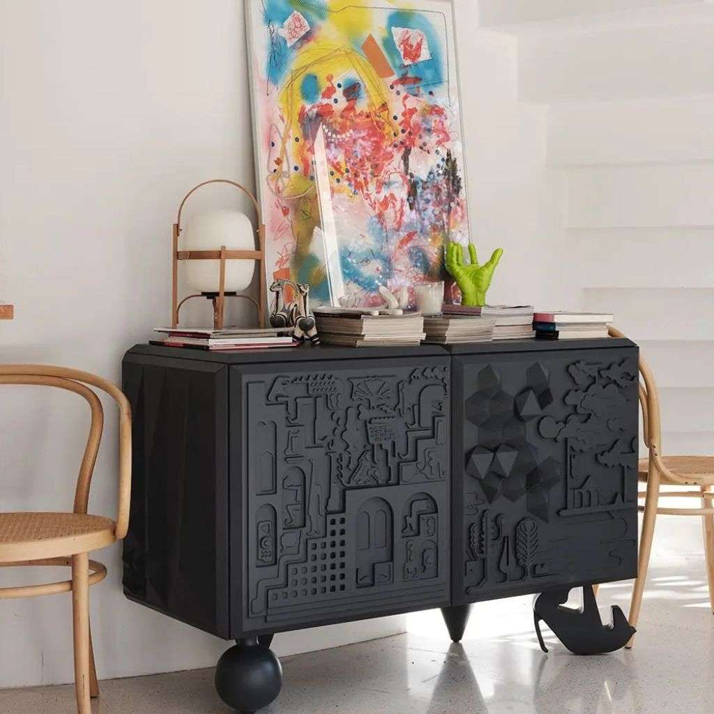BD Barcelona sculptural black cabinet with contemporary art and books