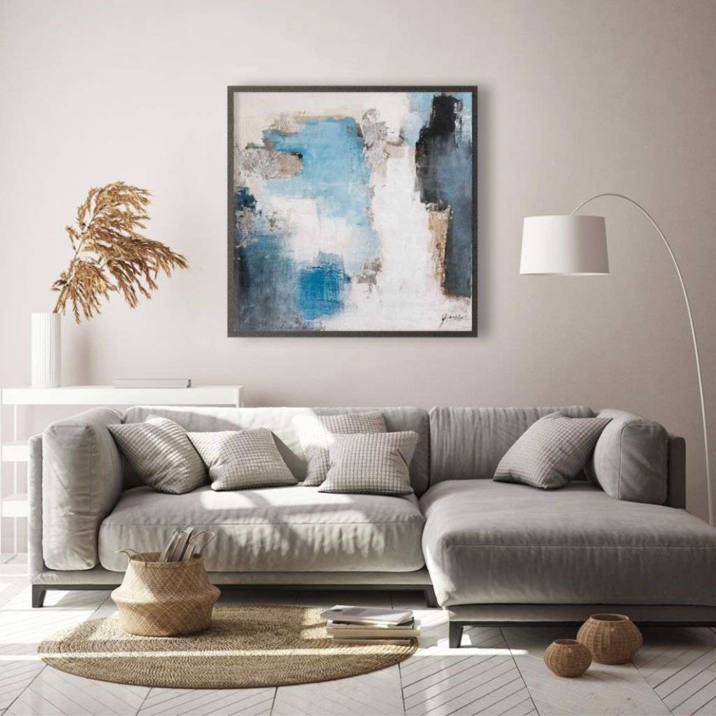 Contemporary living room with a painting by Berkeley Designs above a light grey sofa.