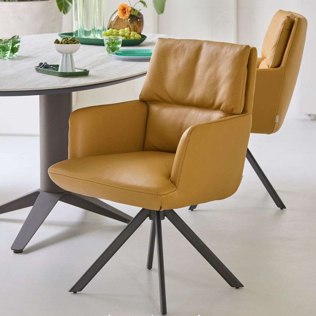 Sleek Bert Plantagie armchairs complementing a minimalistic dining space.
