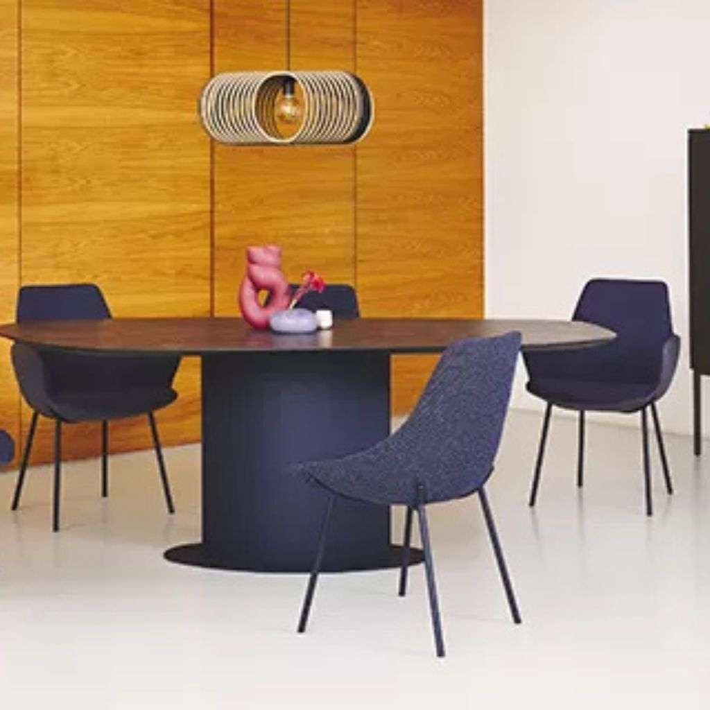 Bert Plantagie modern dining room with stylish chairs and pendant lighting.