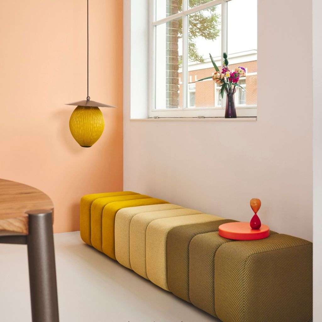 Bert Plantagie stools providing a pop of color and style in a chic room.