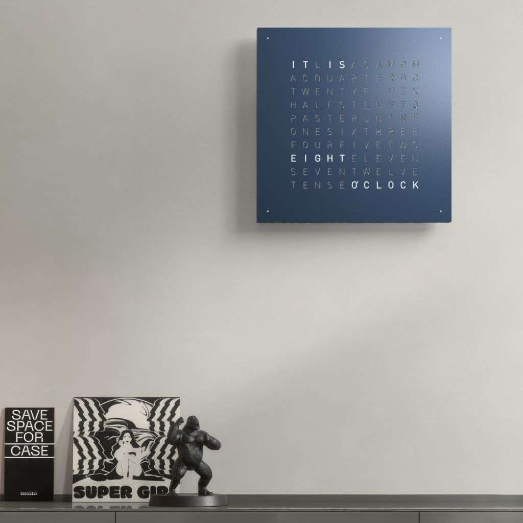 Biegert & Funk clock with a striking orange finish, complementing a vibrant spring theme.