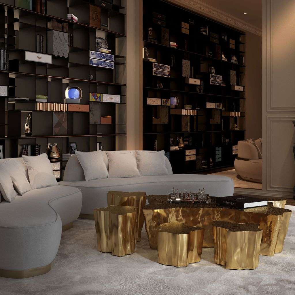 Boca do Lobo modern living room with gold accent coffee tables and shelving.