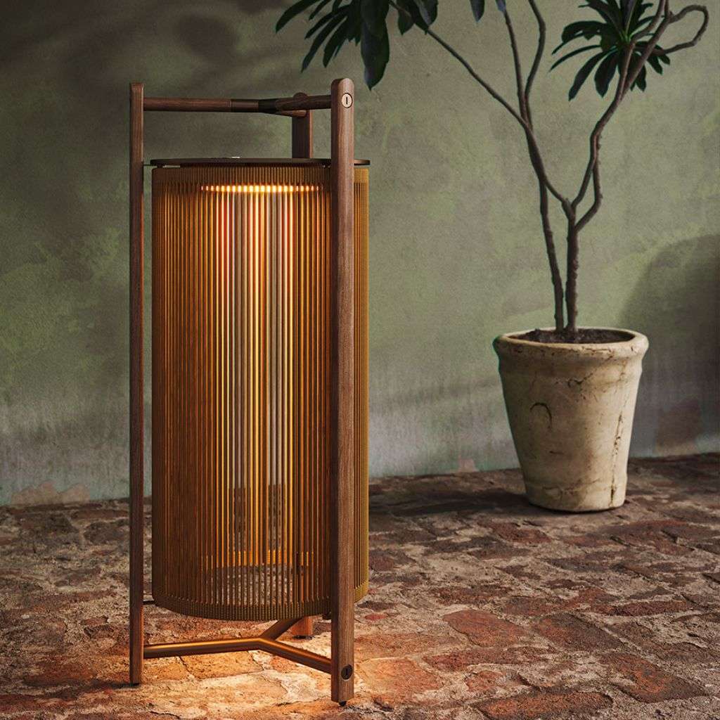 Bover light fixture creating a soft glow in a chic, rustic interior.