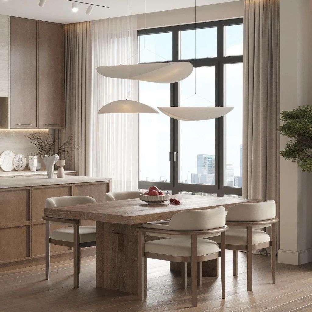 Brune wooden dining table with elegant, round chairs.