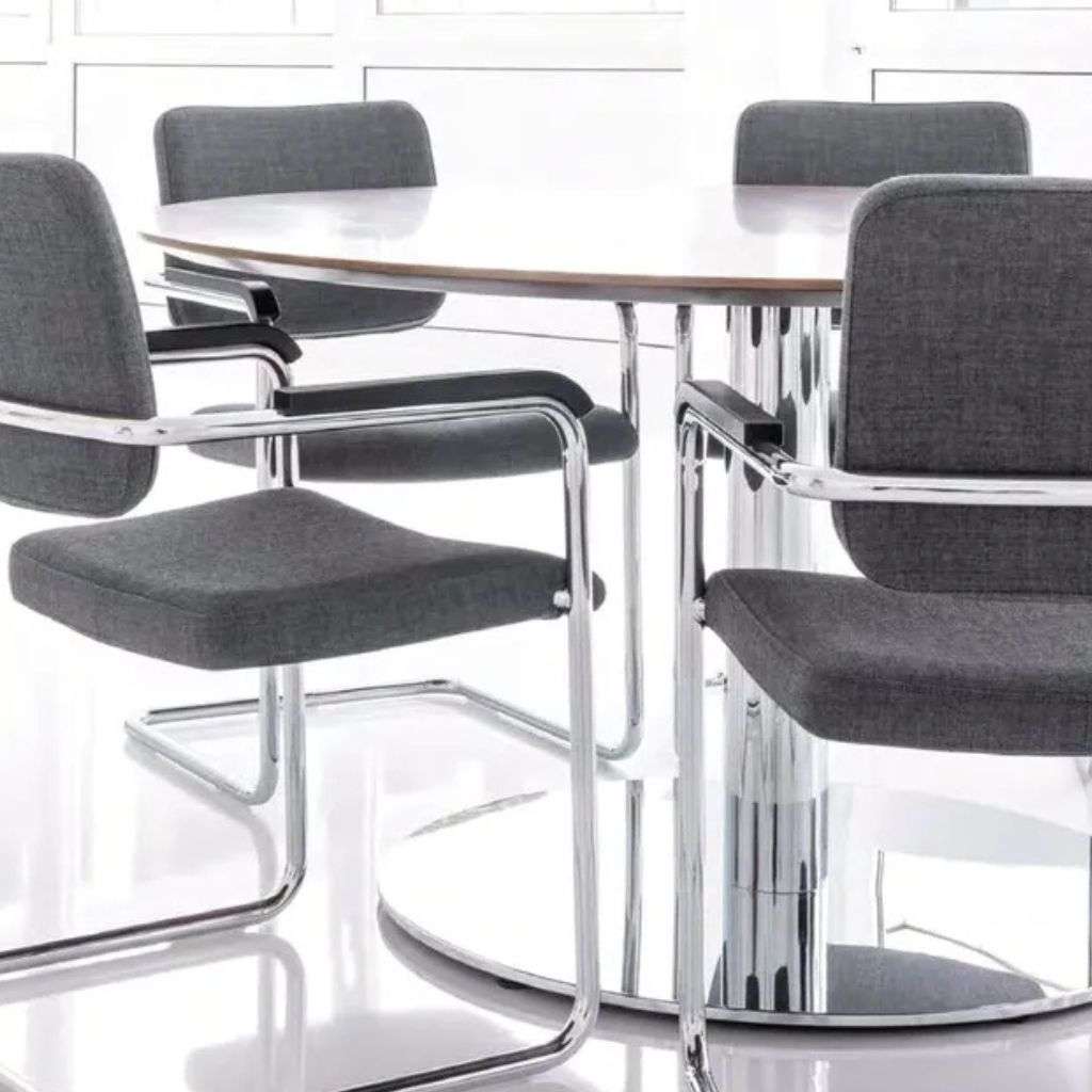 Brune chrome and fabric chairs paired with a round table.