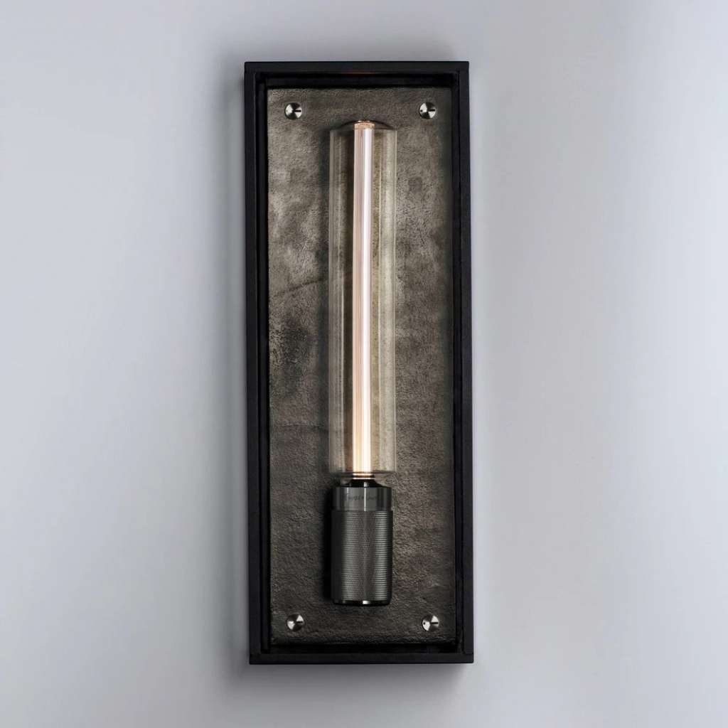 Buster and Punch sleek wall sconce with illuminated tube design.