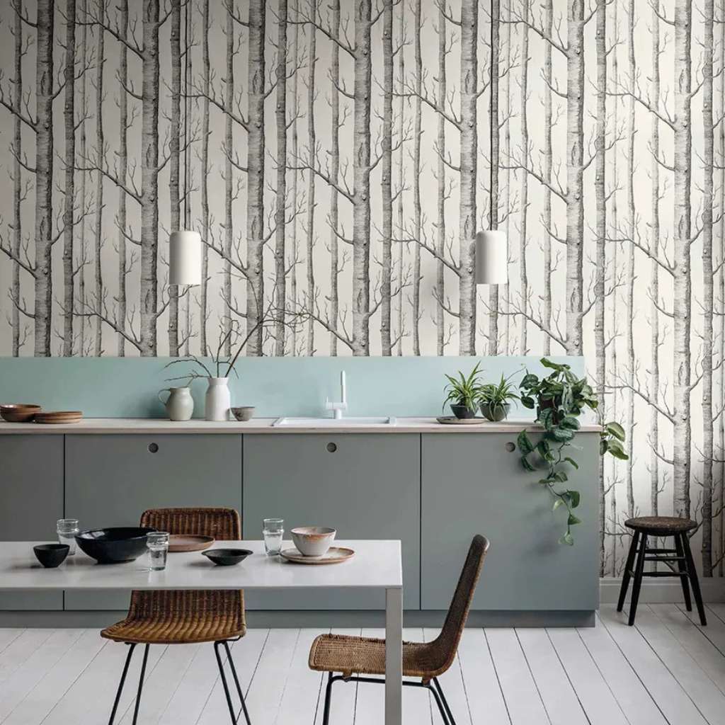 Black and white tree design wallpaper from Cole and Son in a kitchen space.