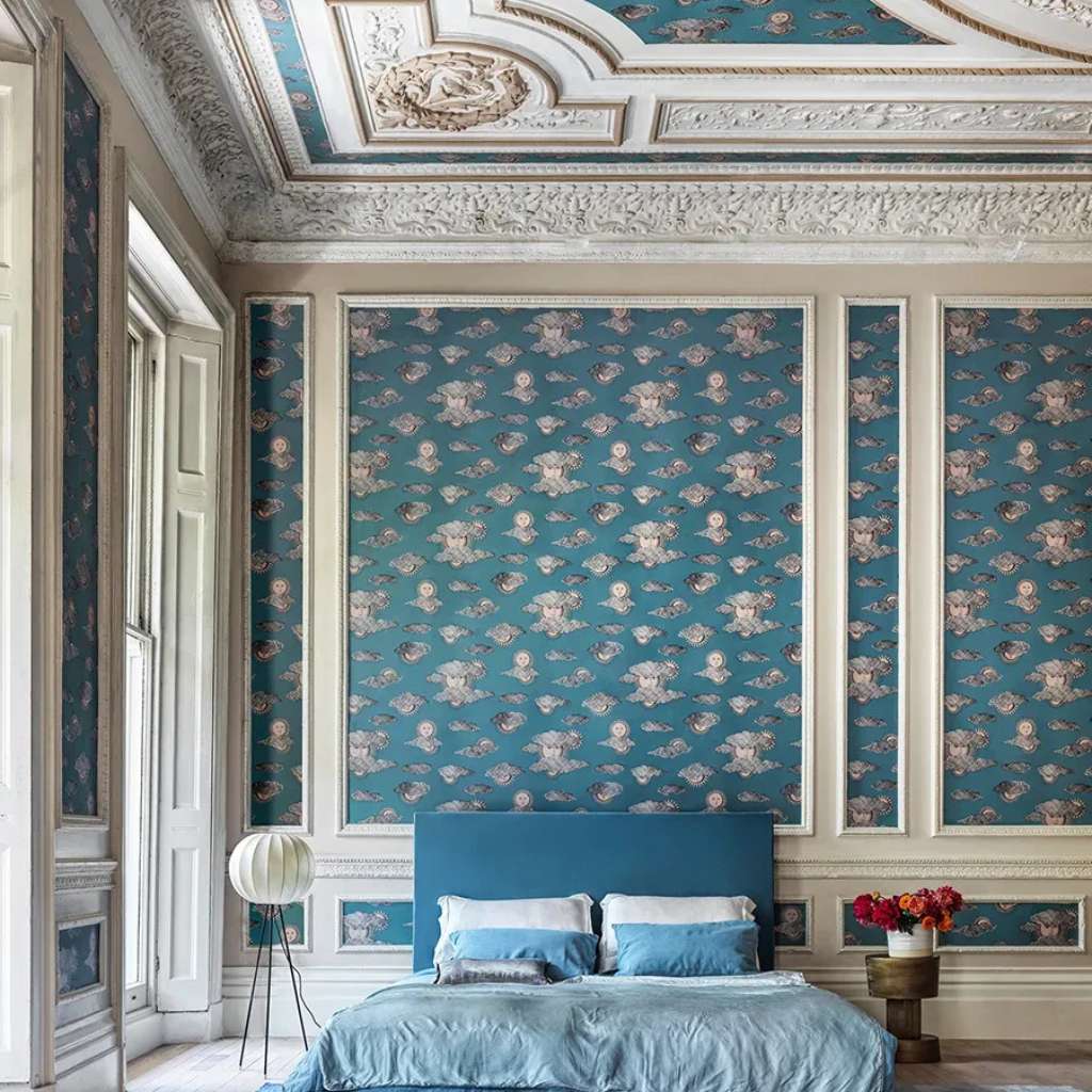 Classic blue floral wallpaper in a bedroom setting by Cole and Son.