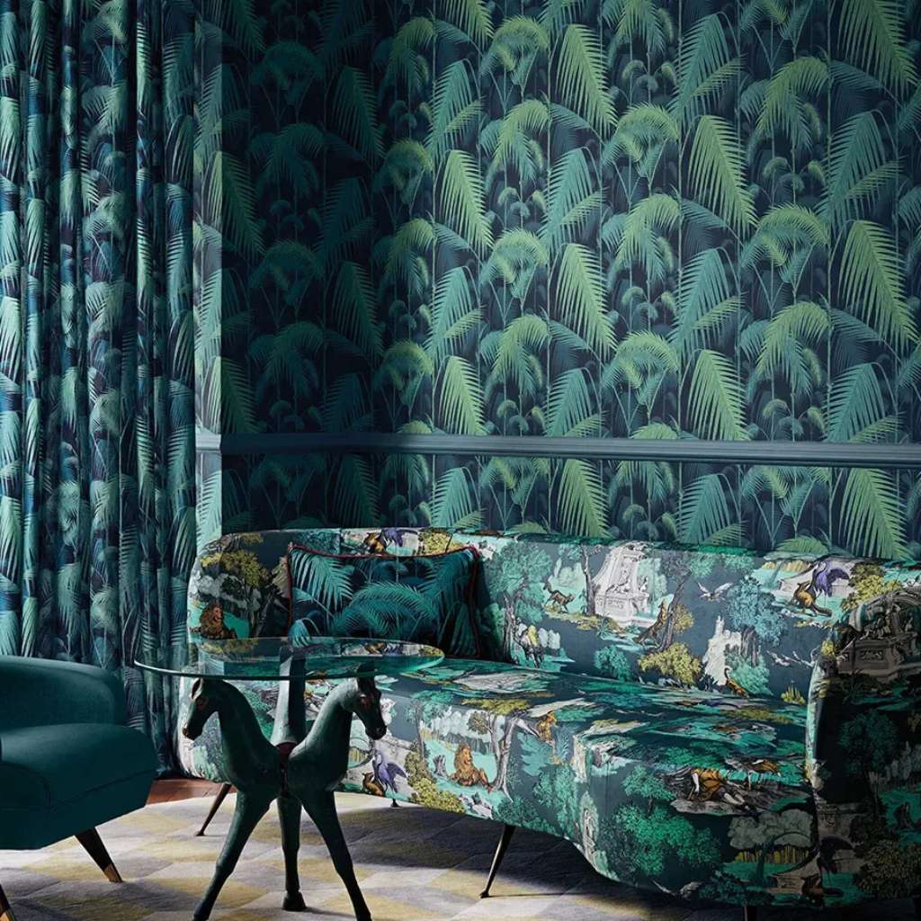 Jungle-themed wall covering and matching curtains by Cole and Son.