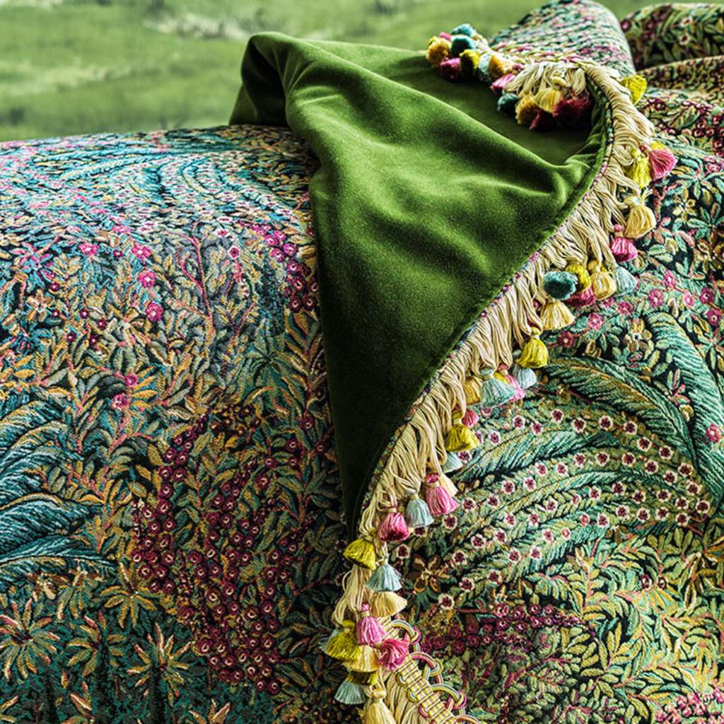 Vibrant embroidered throw with detailed floral pattern by Cole and Son.