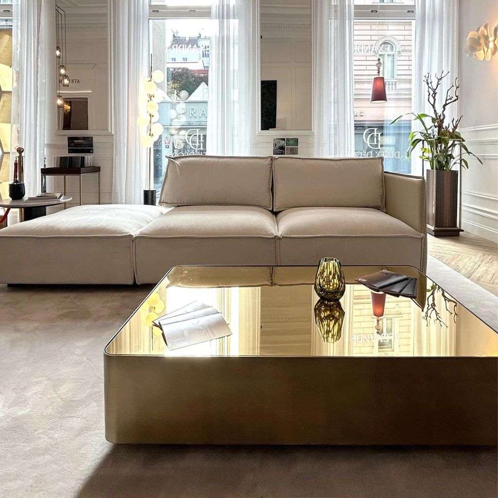Beige sofa with gold coffee table, showcasing elegance from Collection Alexandra.