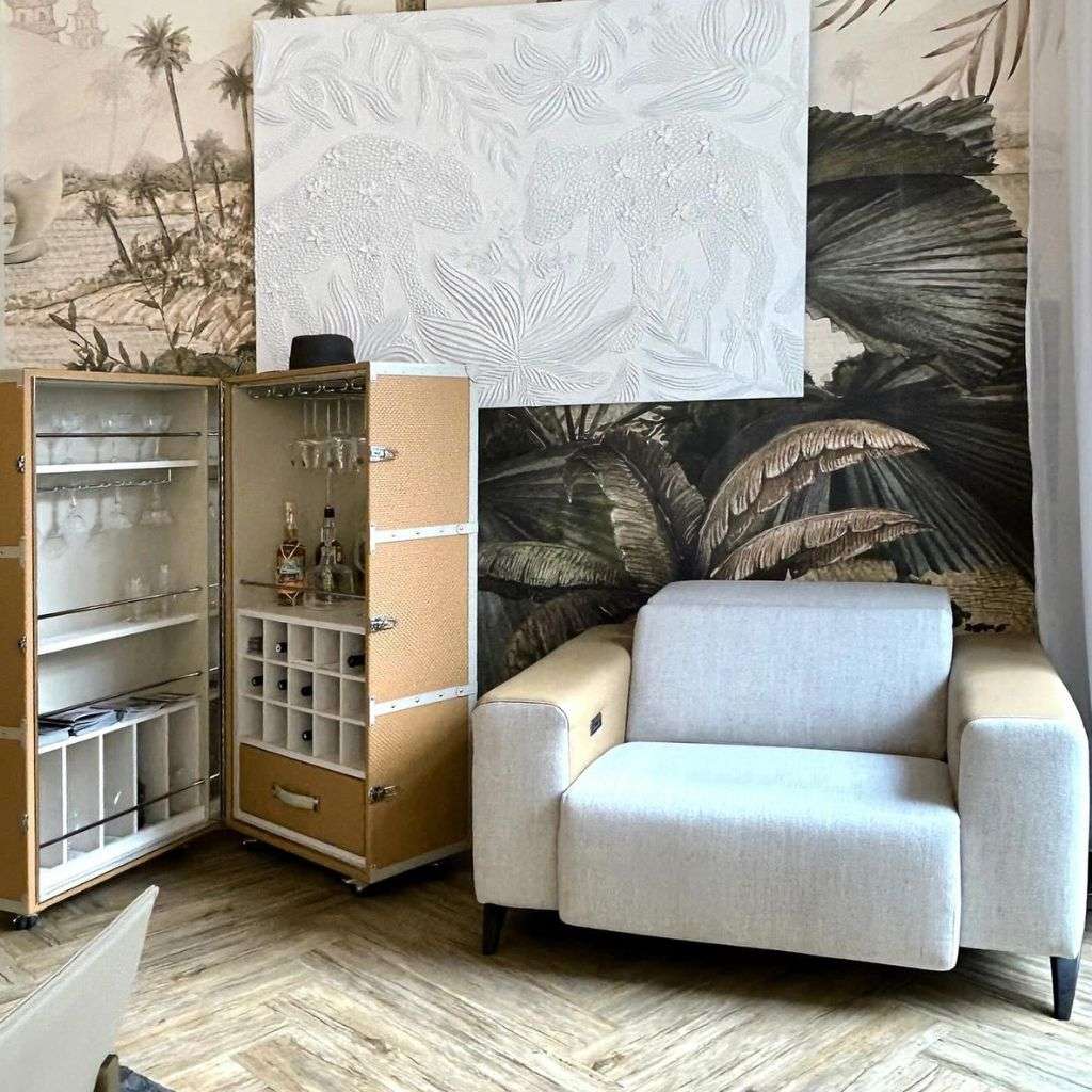 Contemporary armchair and bar cabinet with exotic wallpaper by Collection Alexandra.