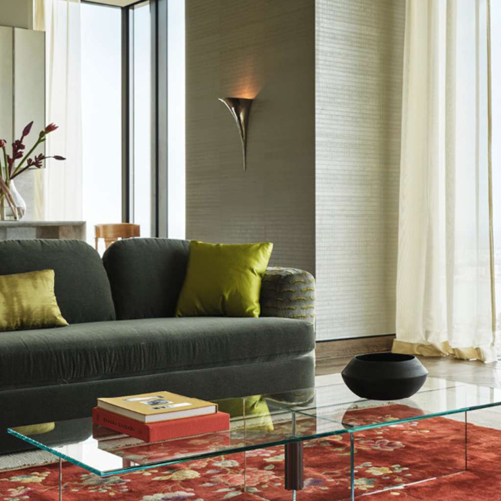 Dedar-designed living room with a vibrant rug and scenic city view