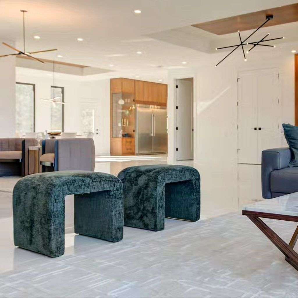 DK Modern's unique velvet stools add a modern, plush touch to the clean, minimalist design of a kitchen space.