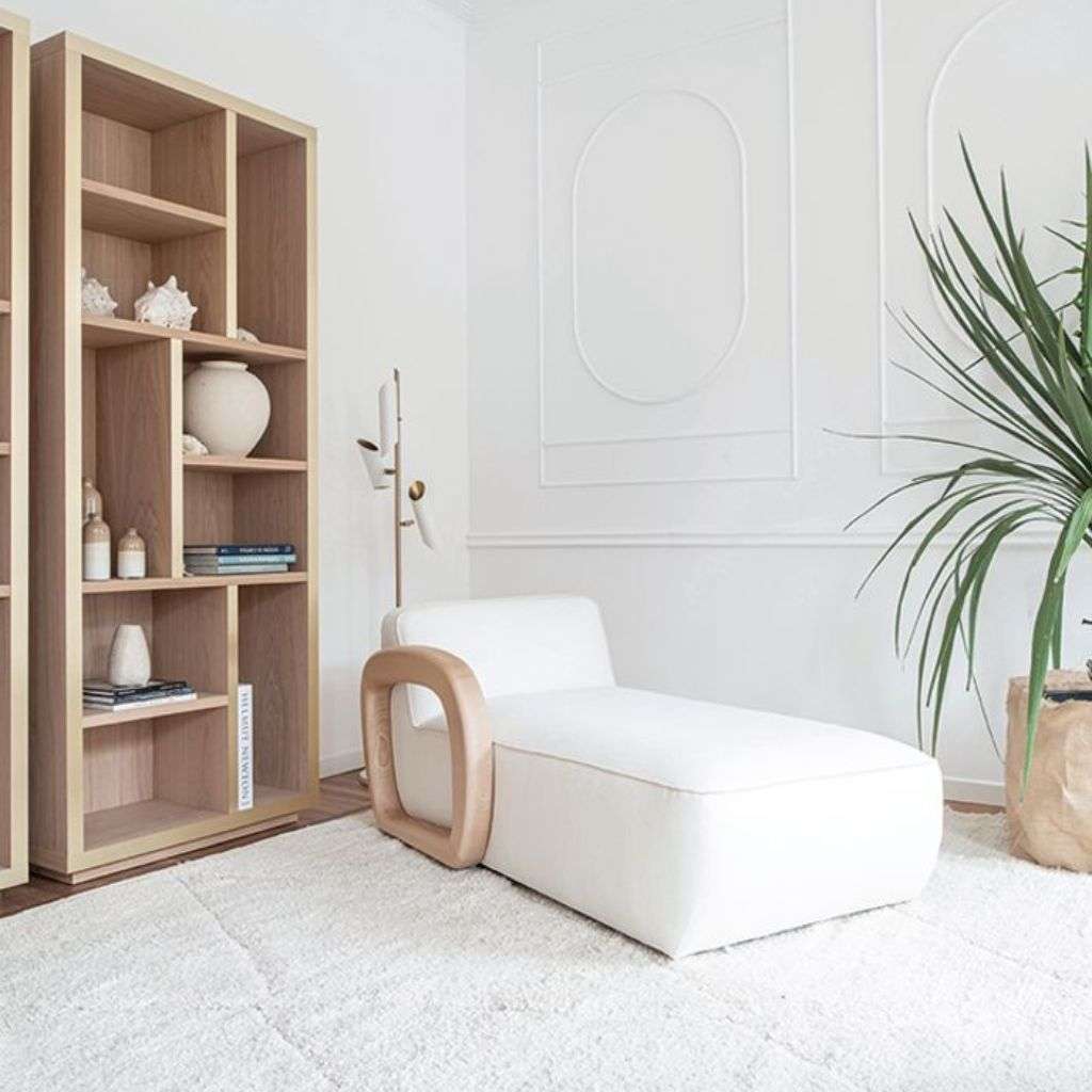 Contemporary chaise lounge and bookshelves designed by Dom Edizioni.