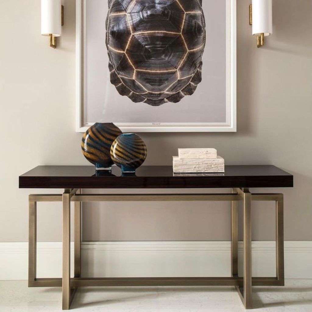 Stylish console table with unique art piece and vases from Dom Edizioni.
