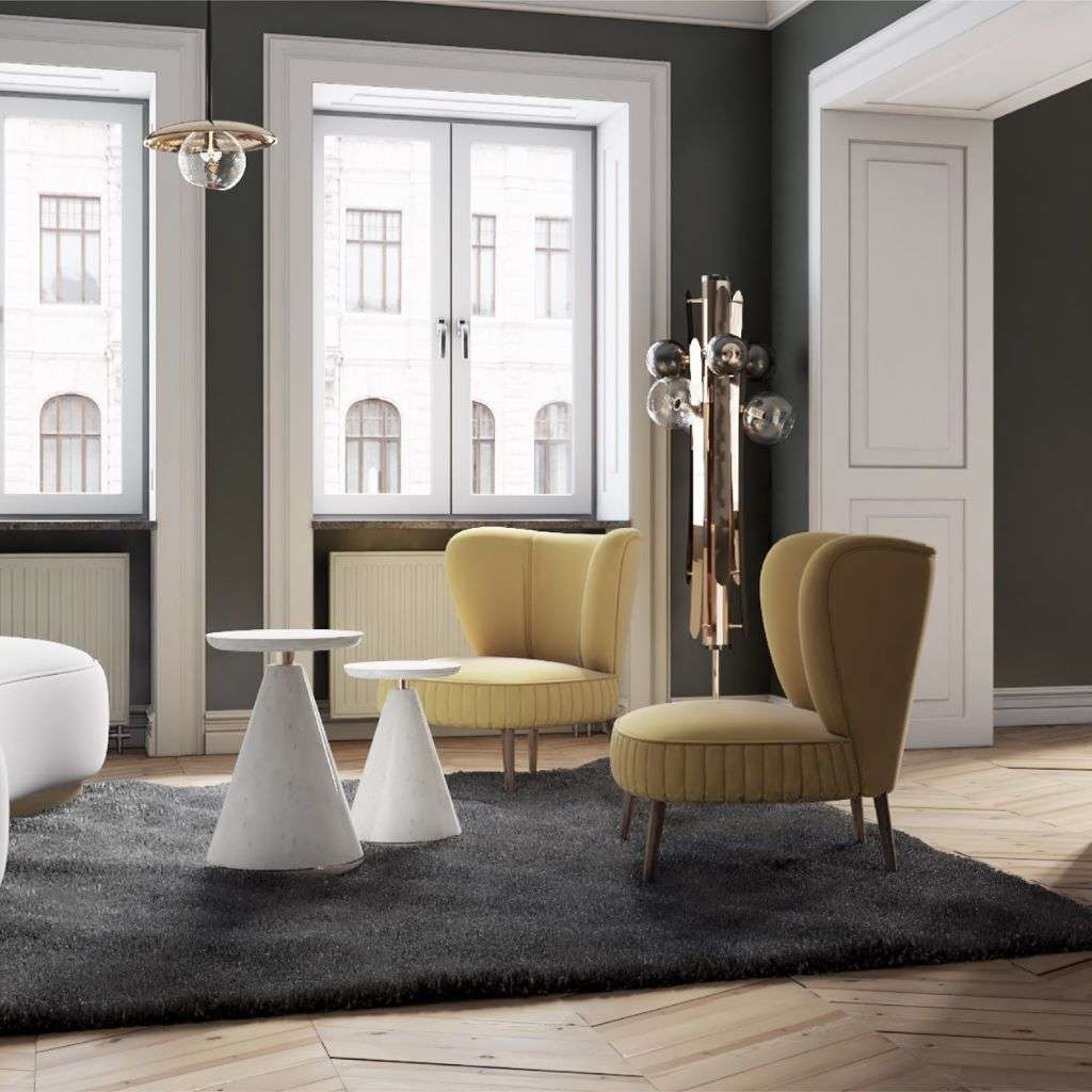 Duquesa & Malvada mustard lounge chairs with white cone side tables in a bright room