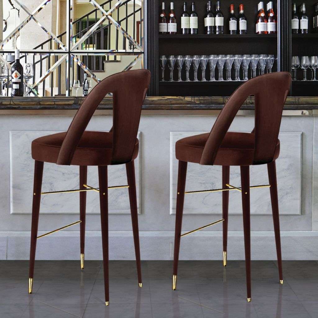 Duquesa & Malvada brown velvet bar stools with gold footrests for a luxury home bar