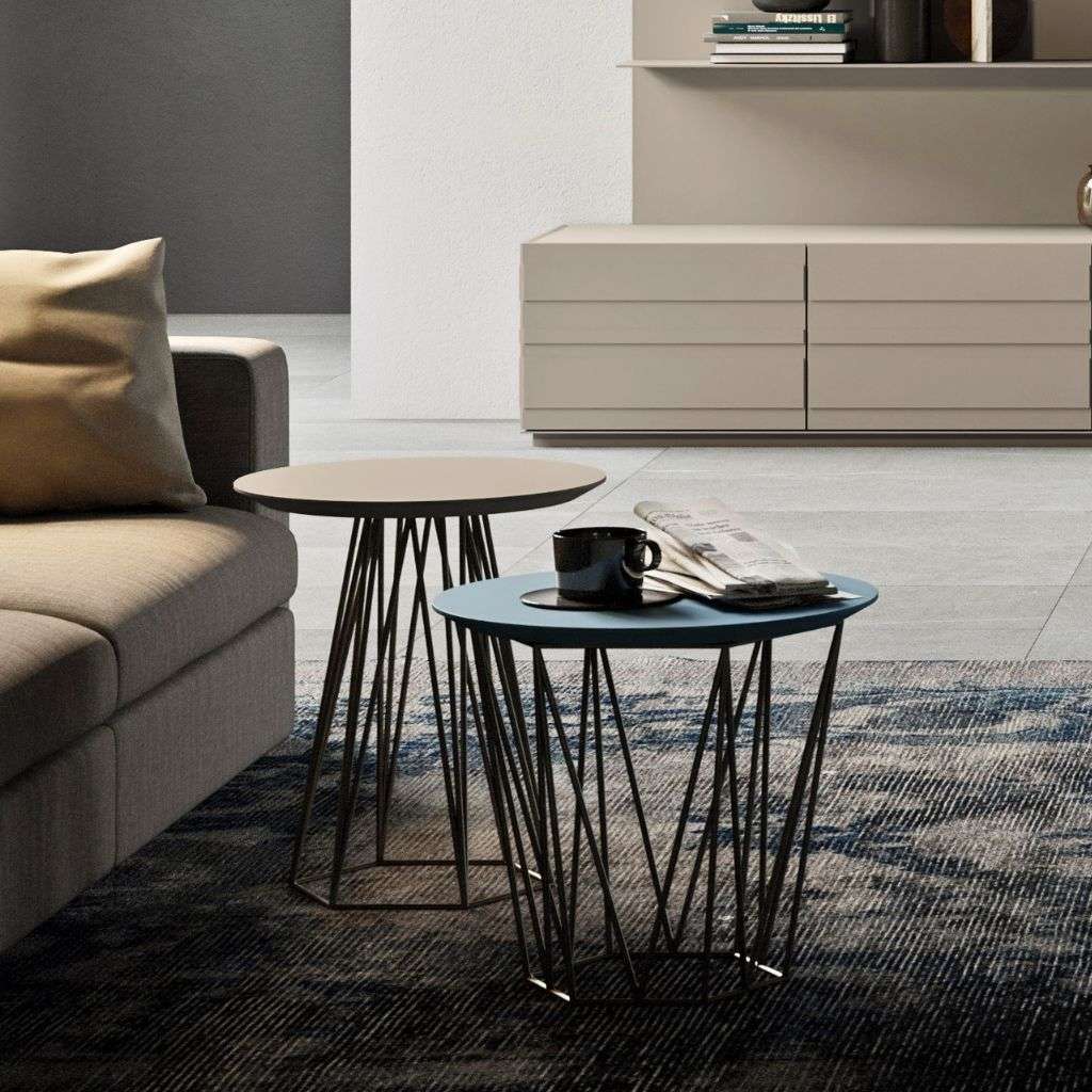 Emmebi round side tables with wire bases beside a contemporary sofa and media unit.