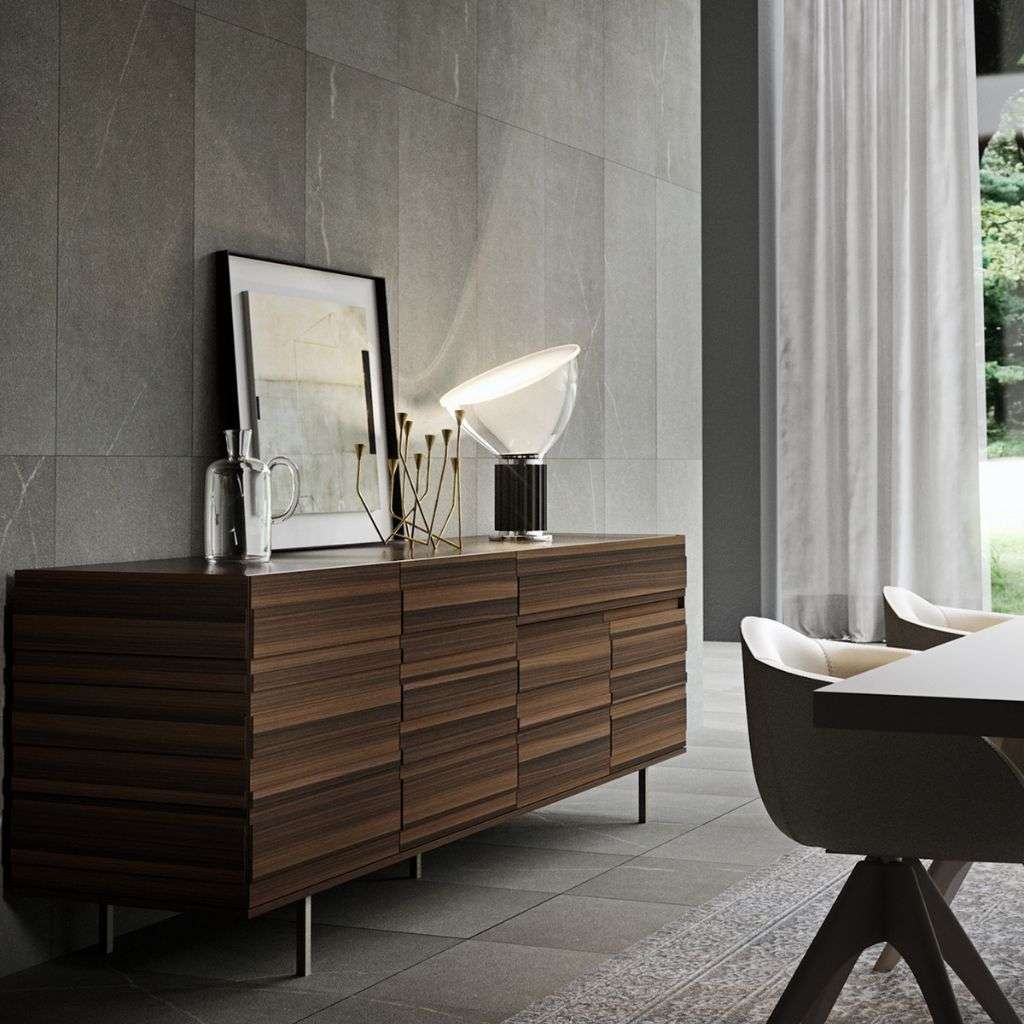 Emmebi walnut sideboard with ribbed fronts, styled with glass lamp and artwork.