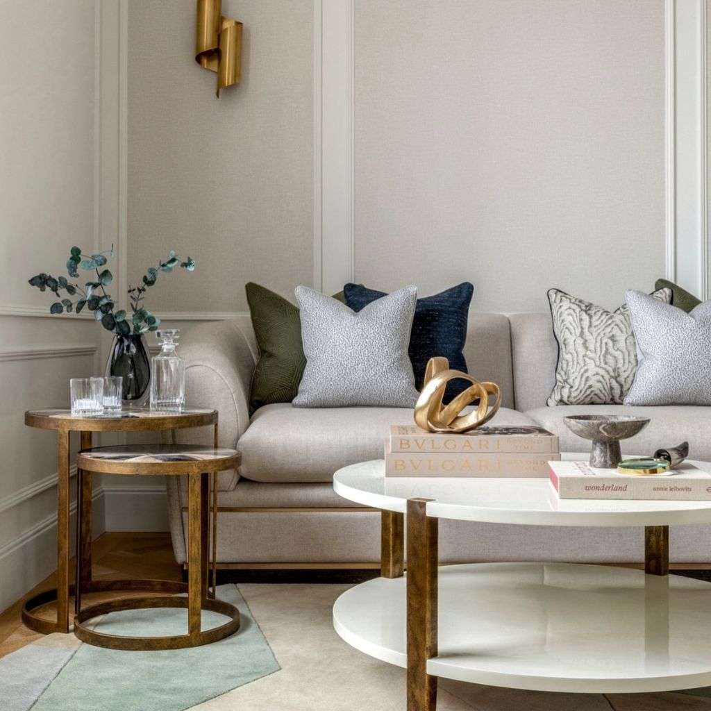 Evitavonni cozy sofa with geometric-patterned cushions and refined decor.