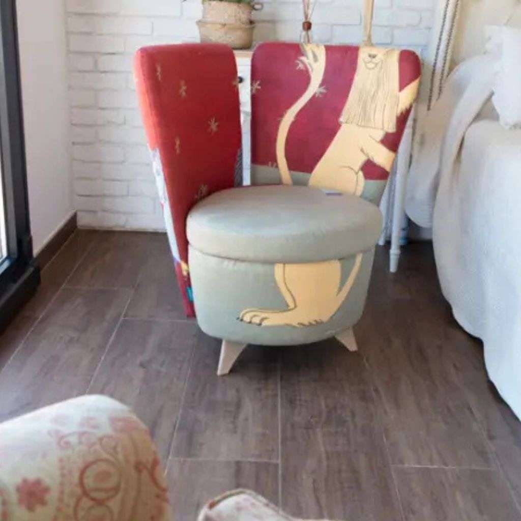 Fama's artistic armchair with bold, playful lion-themed upholstery.