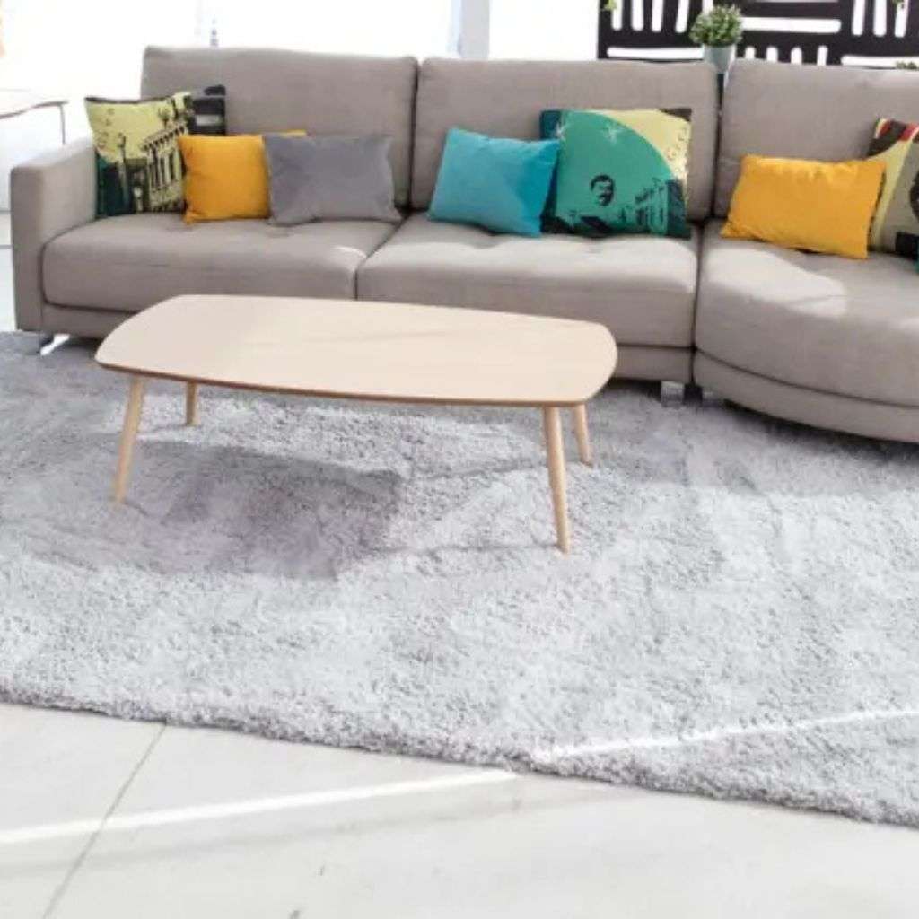 Casual sofa with colorful cushions from Fama, adding comfort and style to a living space.