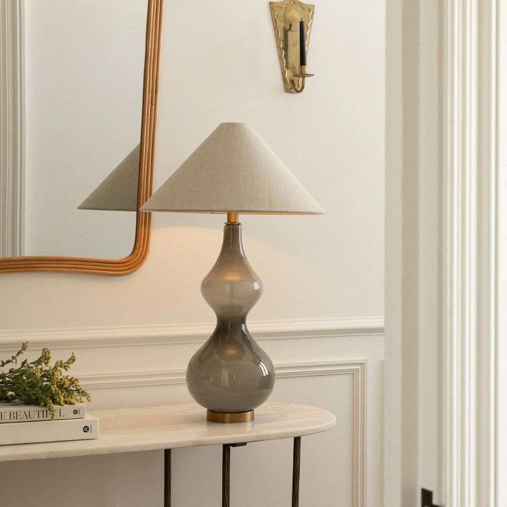 Heathfield smoky glass table lamp with linen shade on a hallway console table