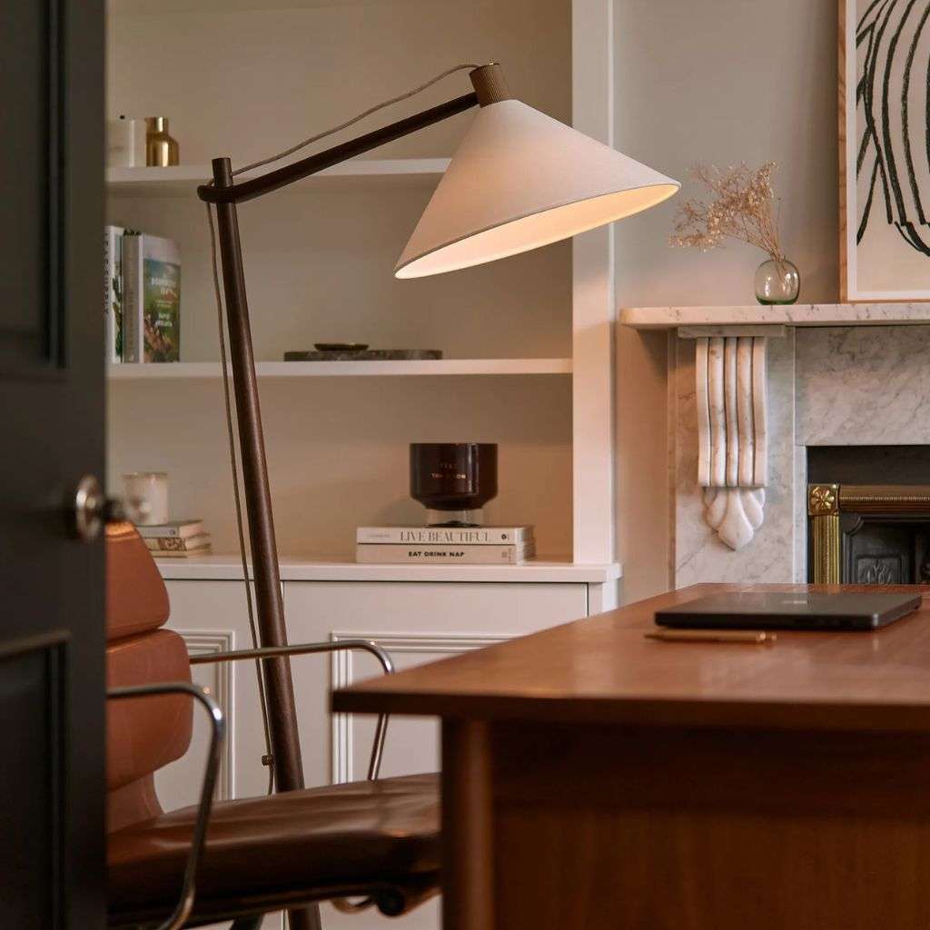 Heathfield adjustable floor lamp with large cone shade in a warm home office