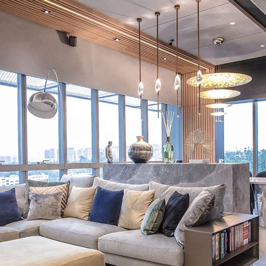 Modern glass table with Villa Nova rug and minimal decor.